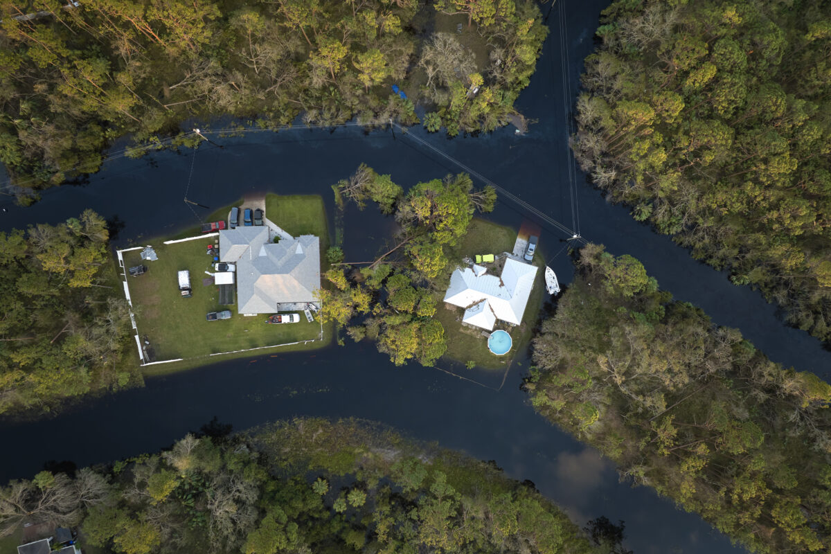 Surrounded by hurricane Ian rainfall flood waters homes in Florida residential area. Consequences of natural disaster