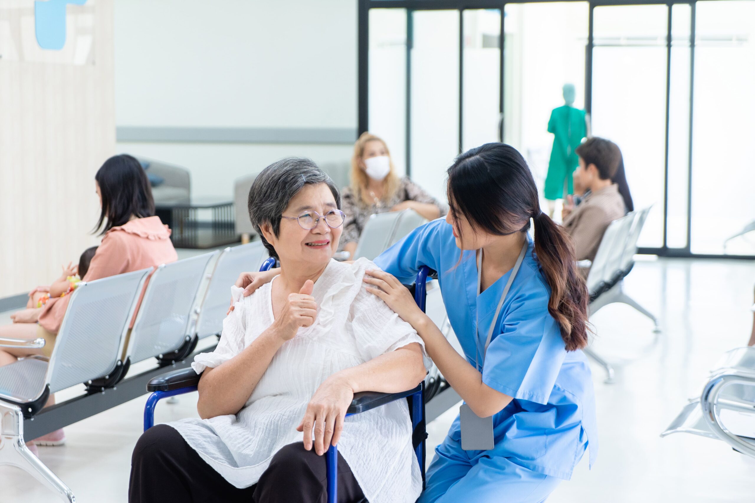 young-nurses-talk-to-an-elderly-woman-about-taking-2026-03-20-02-18-56-utc